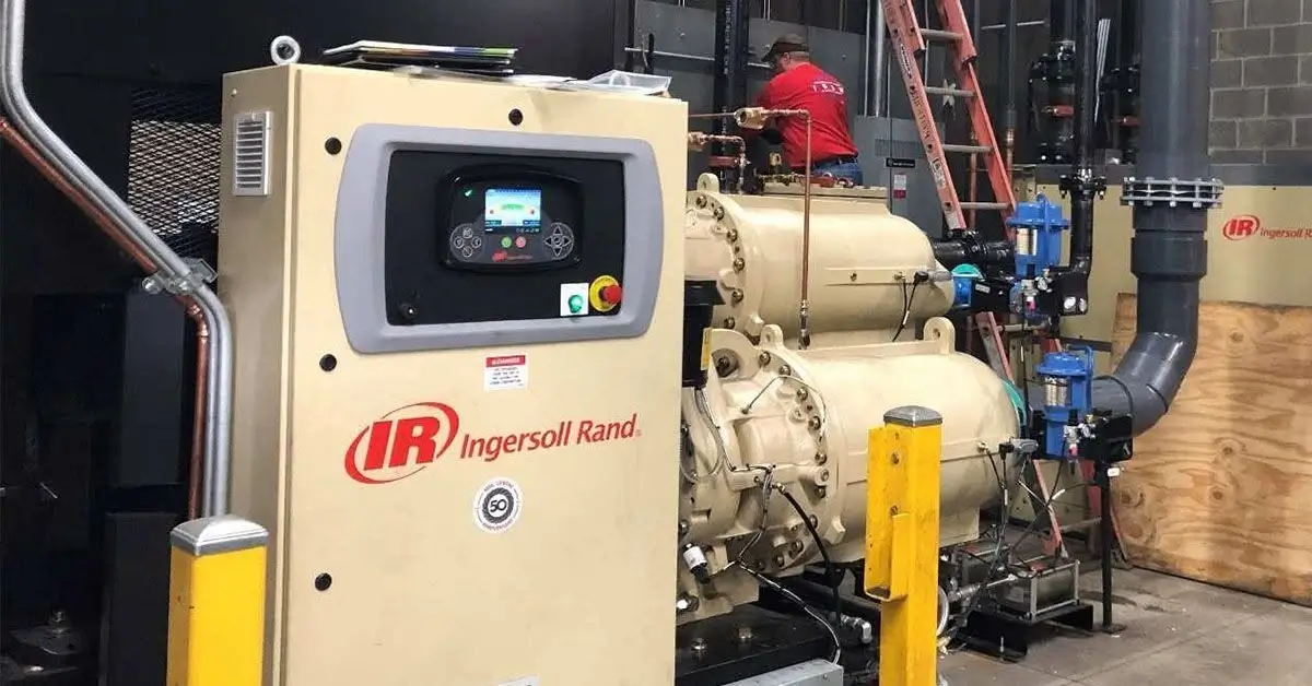 APO technician performing scheduled preventative maintenance on an air compressor at an Ohio facility